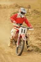 Riding a motocross bike photo