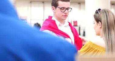 Attractive Couple Shopping In A Man's Clothing Store photo