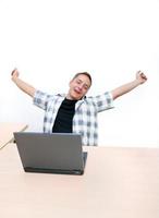 young man working on laptop photo