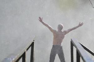 Man in waterfall photo