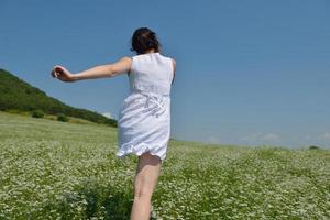 Young happy woman in green field photo