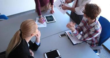 Business Team At A Meeting at modern office building photo