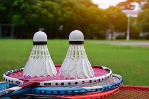 Outdoor badminton playing equipments on green lawn. photo