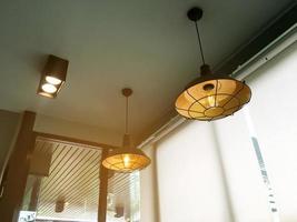 Traditional ceiling lamps hanging from the ceilling in vintage style decoration of the house in asian country, soft and selective focus. photo