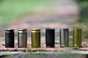 9mm pistol bullet shells on brick floor, soft and selective focus, concept for searching a key piece of evidence in a murder case at the scene. photo