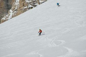 Skiers on mountain photo