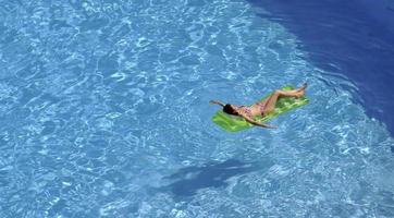 woman relax at swimming pool photo