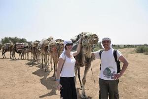 Posing with camels photo