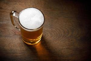 Glass of Light Beer with wheat on the bar counter, copy space for your text photo