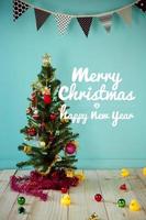 Christmas tree and Christmas decorations and text - Merry Christmas and Happy New Year photo