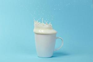 Milk splashing from the cup photo