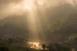 The sunbeam shining to the land in the countryside of Chiang Mai province of Thailand. photo