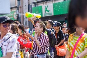 Siam Square, Bangkok, Thailand - APR 13, 2019 short action of people joins celebrations of the Thai New Year or Songkran in Siam Square. photo