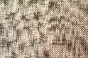 Detailed close up view on samples of cloth and fabrics in different colors found at a fabrics market photo