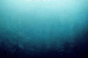 A computer generated illustration of a grunge wall surface texture background in blue, teal, turquoise colour. A.I. generated art. photo