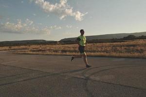 triathlon athlete running on morning trainig photo