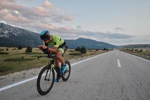 triathlon athlete riding bike photo