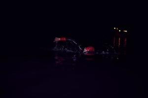 triathlon athlete swimming in dark night  wearing wetsuit photo