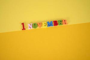 November 1st. Image of november 1 calendar on yellow background. Empty space for text photo