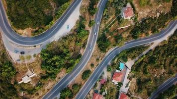 Aerial view of winding road through residential area video