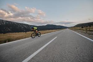 triathlon athlete riding bike photo