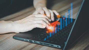 Charts from laptop with analysis of financial, technology, banking and investment concepts, businessman use laptop computer to work. photo