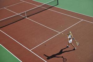 young woman play tennis photo