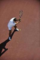 young man play tennis photo