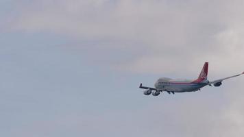 NOVOSIBIRSK, RUSSIAN FEDERATION JUNE 27, 2021 - Long shot Cargo Boeing 747 of Cargolux airlines prepares for landing at the airport. video