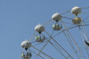 Ferris wheel on the background of blue sky photo