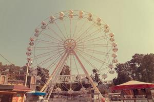 Ferris wheel on the background of blue sky photo