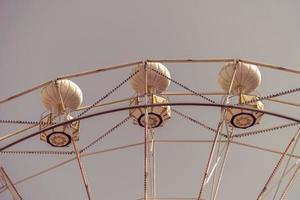 Ferris wheel on the background of blue sky photo