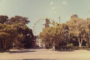 Ferris wheel on the background of blue sky photo