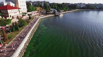 Aerial view of the shore, boardwalk, sailing boats, jet ski video