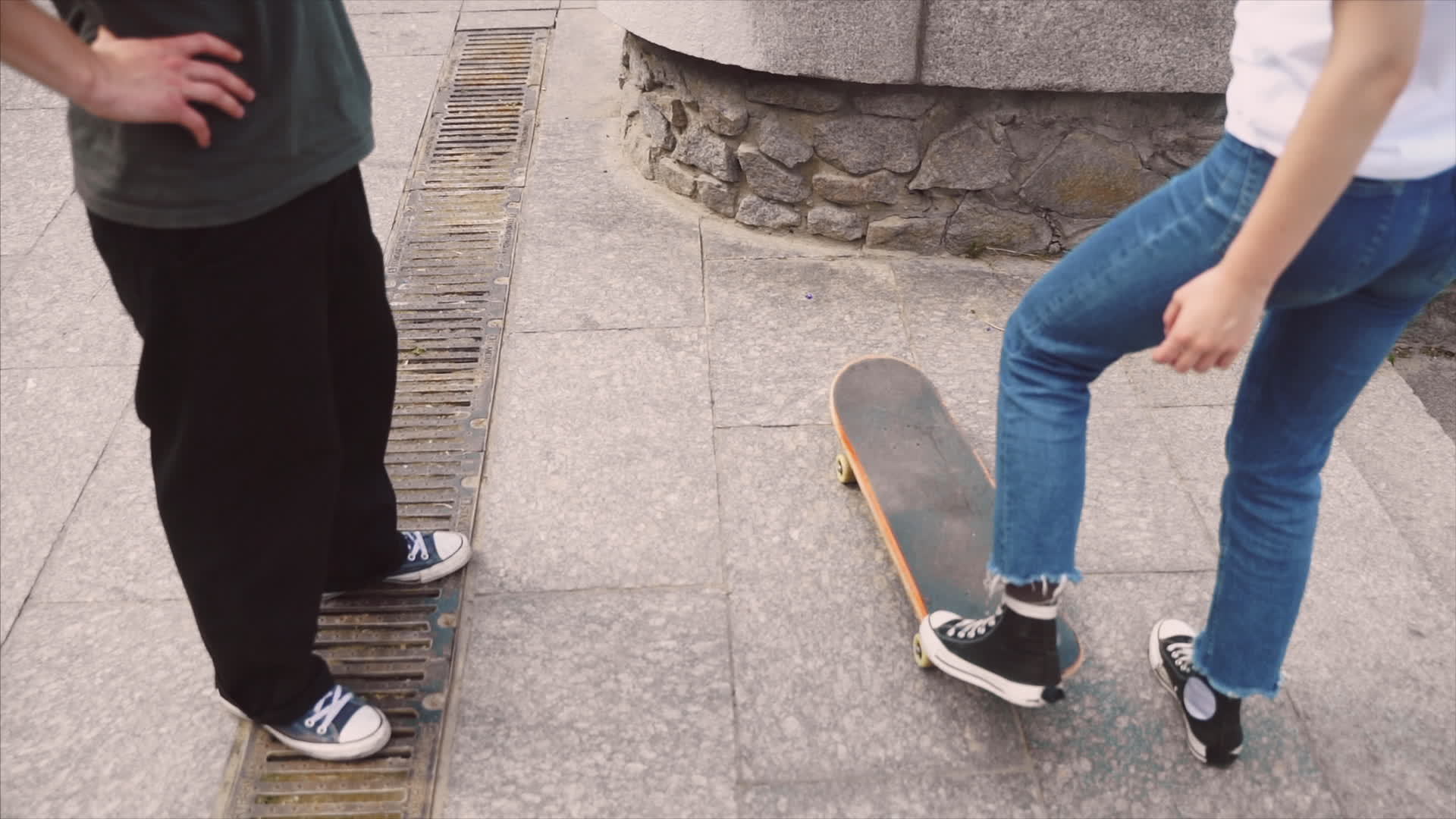 Two young people practice skateboarding footwork on concrete 11607372 ...