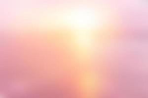 abstract blurred beautiful pastel color of sunset beach with lens flare effect background. photo