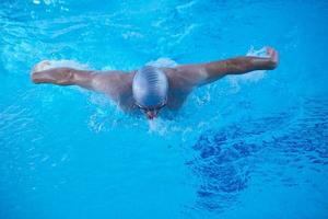 swimmer excercise on indoor swimming poo photo