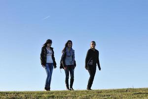 group of teens have fun outdoor photo