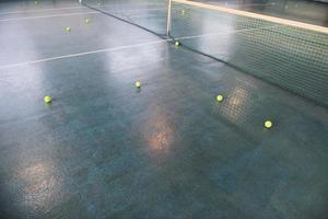 Tennis balls on floor photo