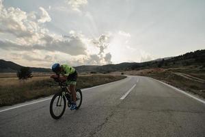 triathlon athlete riding bike photo