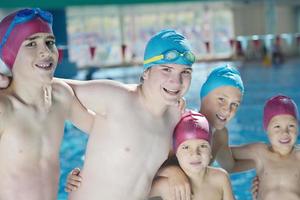 happy children group  at swimming pool photo