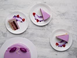 A top view shot of purple cake sliced on a white plates photo