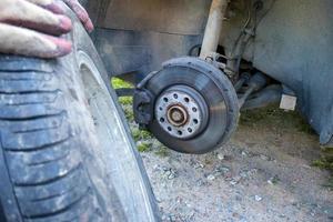 Change a flat car tire on road with Tire maintenance, damaged car tyre photo