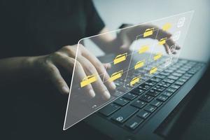 Officer using laptop manage files, Document Management System DMS, Online document database management, automated processes to manage system, ERP enterprise efficient, business technology. photo