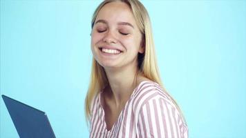 Young woman with futuristic tablet laptop video