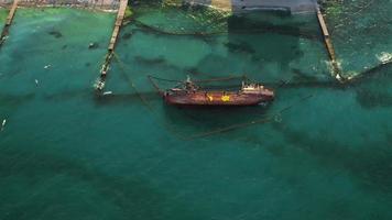 Aerieal view of a wrecked cargo ship on the shore