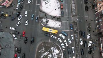 Aerial view of snowy Kyiv or Kiev city, top view of streets and cars video