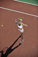 young woman play tennis outdoor photo