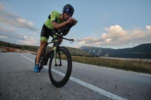 triathlon athlete riding bike photo