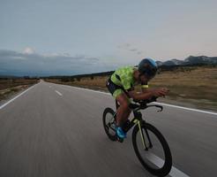 triathlon athlete riding bike photo